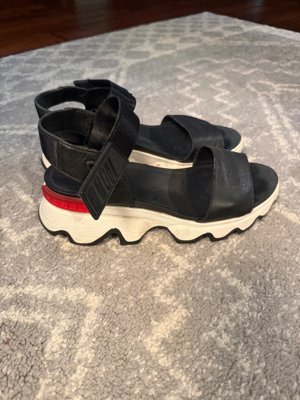 Sorel Black Platform Sandals with White and Red Sole Accent